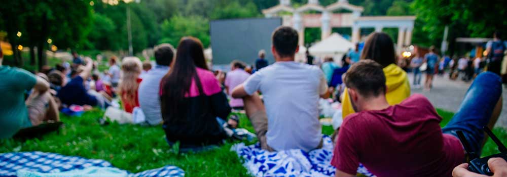 outdoor festival with people relaxing and watching music