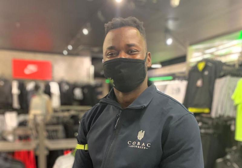 Cobac security officer wearing facemask for covid-19 requirements